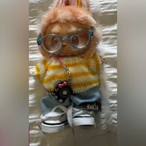 Sporty Labubu outfit with Hermes logo on shorts.